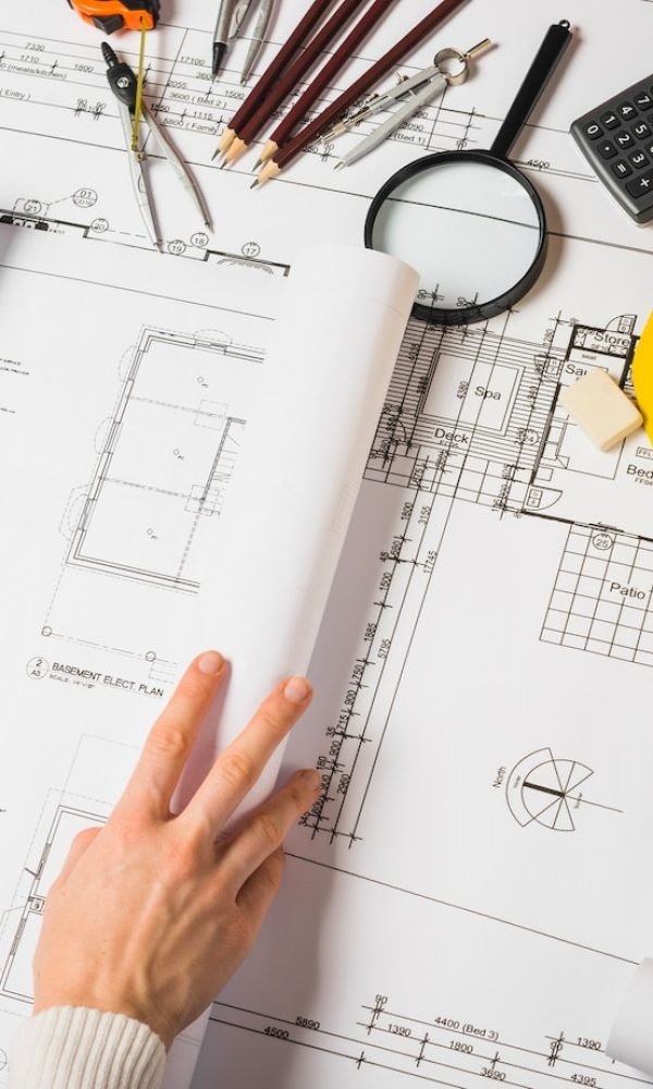 crop-architect-opening-blueprint_23-2147710985